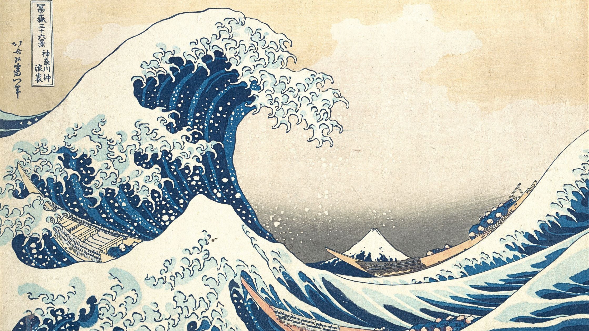Famous artwork of a large wave with Mount Fuji in the background